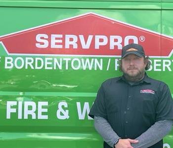 man standing by service truck